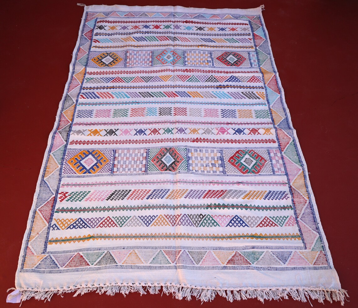 levate your home decor with our white jute rug (3x5)! Handwoven in the timeless Berber tradition, this fluffy Moroccan rug offers a serene and sophisticated aesthetic. The pristine